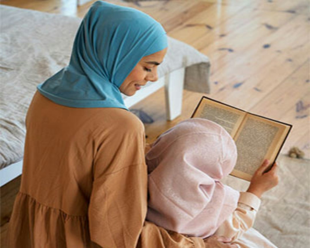 Muslim family learning Quran